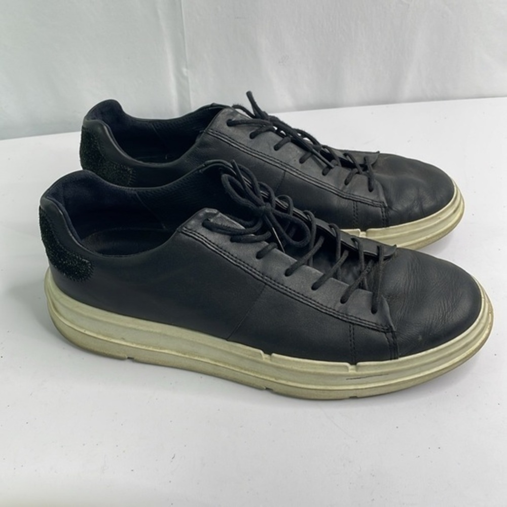 Ecco black leather sneaker with white sole.